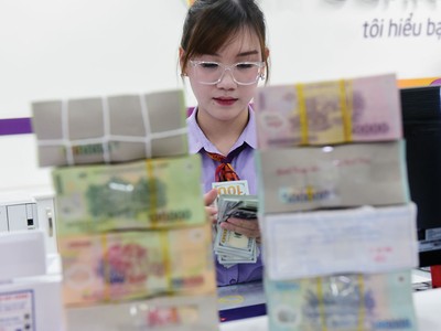 Việc Fed đảo chiều chính sách tiền tệ giúp áp lực lên tỷ giá USD/VND vơi bớt