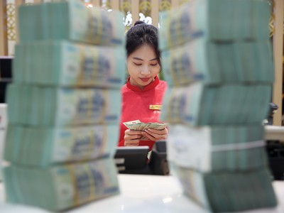 Sức cầu tín dụng đang được cải thiện. Ảnh: Dũng Minh 