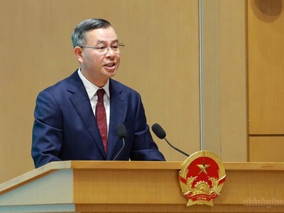 Bộ trưởng Bộ Tài chính Ngô Văn Tuấn trình bày Báo cáo trung tâm của Hội nghị - Ảnh: VGP