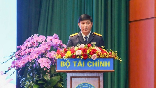 Phó Cục trưởng Cục Thuế Đặng Ngọc Minh báo cáo tại Hội nghị tổng kết công tác năm 2025, triển khai nhiệm vụ năm 2026 ngành Tài chính tổ chức ngày 6/1. Ảnh: Đức Thanh.