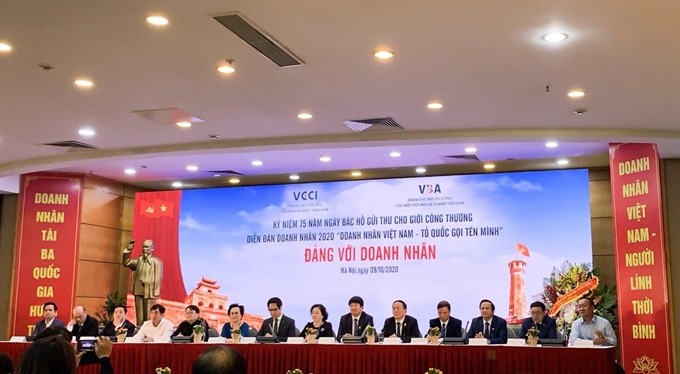 Lễ kỷ niệm 75 năm Ngày Bác Hồ gửi thư cho giới Công Thương và Diễn đàn doanh nhân Việt Nam 2020 “Doanh nhân Việt Nam - Tổ quốc gọi tên mình” diễn ra tại Hà Nội ngày 9/10 (Ảnh: QT/ Dangcongsan). Lễ kỷ niệm 75 năm Ngày Bác Hồ gửi thư cho giới Công Thương và Diễn đàn doanh nhân Việt Nam 2020 “Doanh nhân Việt Nam - Tổ quốc gọi tên mình” diễn ra tại Hà Nội ngày 9/10 (Ảnh: QT/ Dangcongsan).