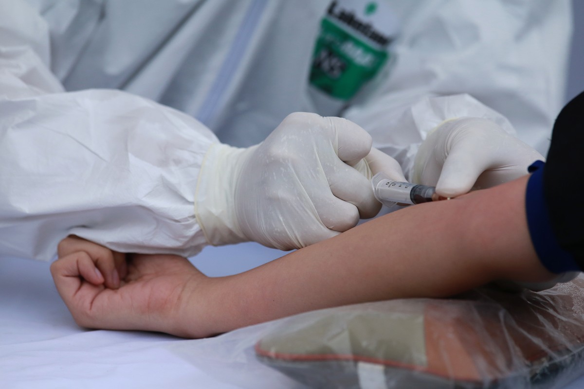 Quy trình test nhanh Covid - 19 trên diện rộng tại Hà Nội ảnh 7