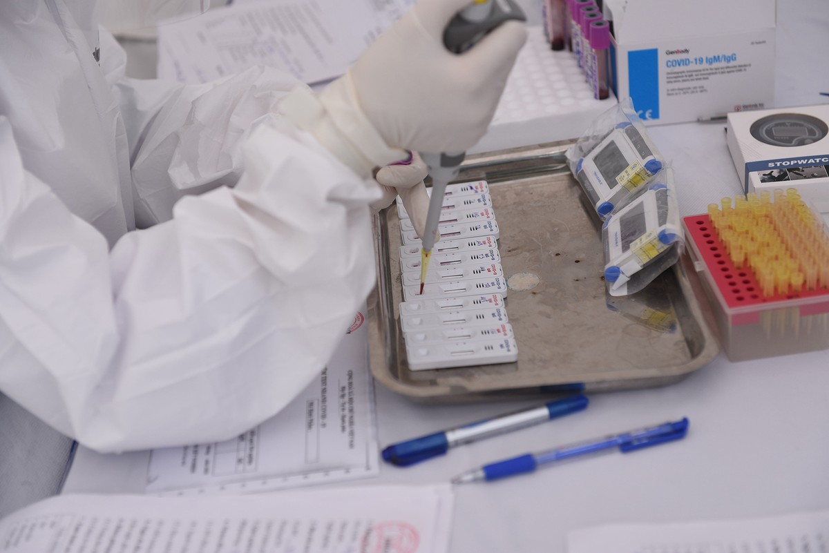 Quy trình test nhanh Covid - 19 trên diện rộng tại Hà Nội ảnh 9