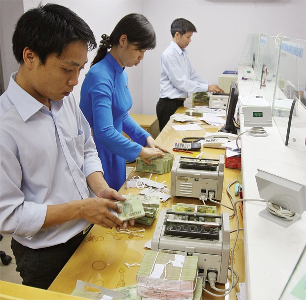 Nhân viên ngân hàng với nỗi lo lương thưởng cuối năm ảnh 1