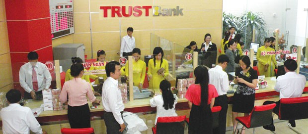 TRUSTBank tích cực tái cơ cấu ảnh 1
