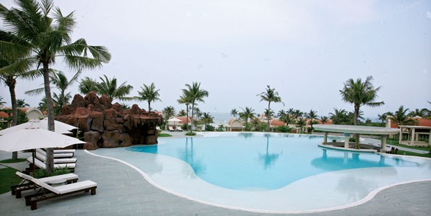 Cửa ra cho bất động sản nghỉ dưỡng ảnh 1