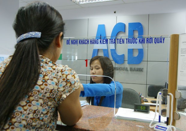 Lợi nhuận ACB giảm vì nợ xấu ảnh 1
