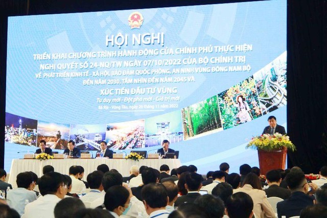 Bộ trưởng Nguyễn Chí Dũng chính thức công bố Chương trình hành động của Chính phủ thực hiện Nghị quyết 24-NQ/TW Ảnh: Lê Toàn