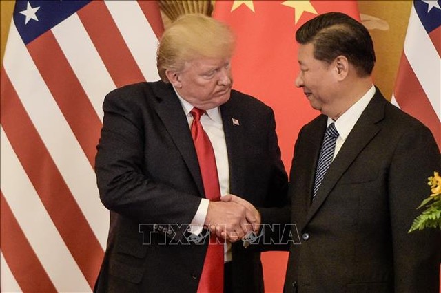 Chủ tịch Trung Quốc Tập Cận Bình (phải) và Tổng thống Mỹ Donald Trump trong cuộc gặp tại Bắc Kinh, Trung Quốc năm 2017. Ảnh tư liệu: AFP/TTXVN Chủ tịch Trung Quốc Tập Cận Bình (phải) và Tổng thống Mỹ Donald Trump trong cuộc gặp tại Bắc Kinh, Trung Quốc năm 2017. Ảnh tư liệu: AFP/TTXVN