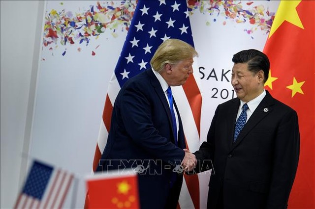 Tổng thống Mỹ Donald Trump (trái) và Chủ tịch Trung Quốc Tập Cận Bình trong cuộc hội đàm bên lề Hội nghị thượng đỉnh G20 tại Osaka, Nhật Bản, ngày 29/6/2019. Ảnh: AFP/TTXVN
