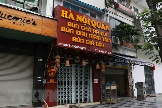 Các cửa hàng, quán ăn trên đường Trương Định, Quận 1 đã nghiêm túc đóng cửa. (Ảnh: Xuân Khu/TTXVN).