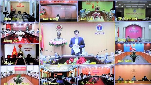 Hội nghị trực tuyến kiểm điểm, đánh giá 10 ngày thực hiện Nghị quyết 128/NQ-CP của Chính phủ. (Ảnh: PV/Vietnam+).