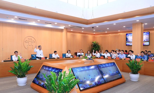 Tập thể UBND TP. Hà Nội biểu quyết thống nhất thông qua các nội dung theo Chương trình.