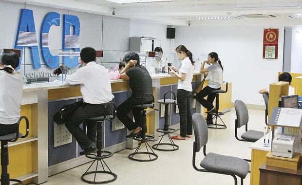 Sau cổ tức, ngân hàng giảm lương, nhân sự ảnh 1