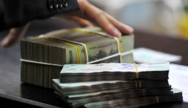 Ngân hàng rút lãi suất tất cả các khoản vay cũ về tối đa 15%/năm ảnh 1