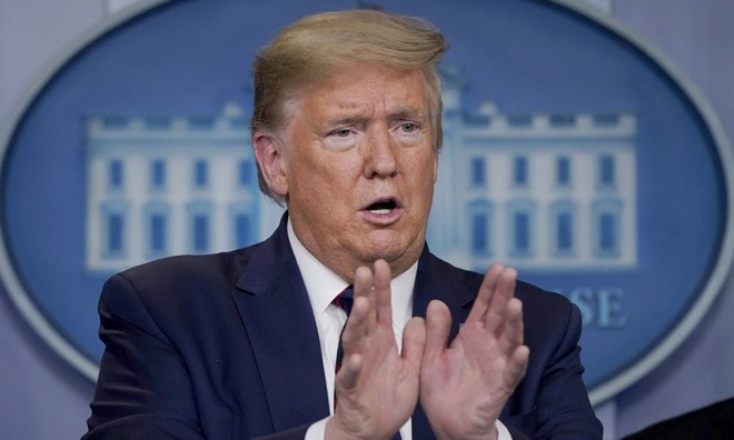 Trump trong cuộc họp báo tại Nhà Trắng hôm 27/3. Ảnh: AFP.