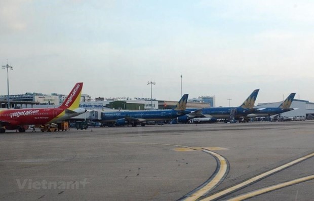 Máy bay của các hãng hàng không Vietnam Airlines và Vietjet. (Ảnh: Việt Hùng/Vietnam+).