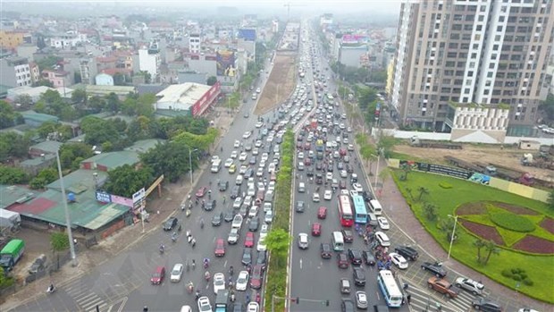 Khu vực Cổ Linh-Đàm Quang Trung sẽ được tổ chức lại giao thông nhằm tránh ùn tắc kéo dài tại đường Cổ Linh hướng lên cầu Vĩnh Tuy vào trung tâm nội thành. (Ảnh: Minh Đức/TTXVN)