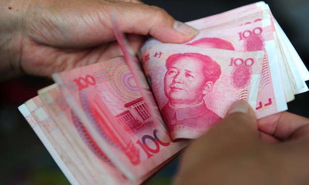 Đồng nhân dân tệ giao ngay mở cửa phiên giao dịch 13/2 ở mức 6,8349 CNY đổi 1 USD. Ảnh: AFP