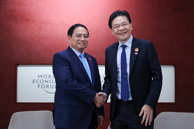 Thủ tướng Phạm Minh Chính và Thủ tướng Singapore Lawrence Wong. Ảnh: Nhật Bắc.