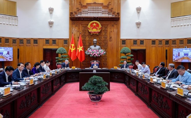 Thủ tướng Phạm Minh Chính chủ trì cuộc họp của Thường trực Chính phủ chiều tối 23/12 - Ảnh: VGP.