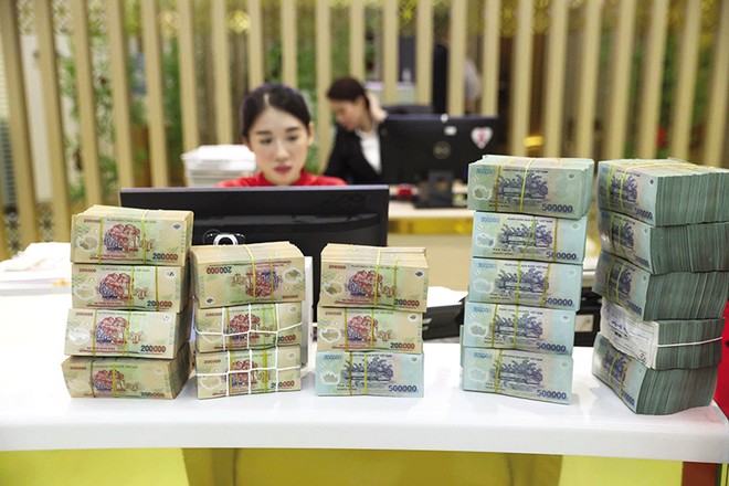 Lãi suất huy động trên thị trường dân cư đã lên tới 9-10%/năm, lãi suất cho vay thả nổi cũng lên tới 14-15%/năm. Ảnh: Đức Thanh 