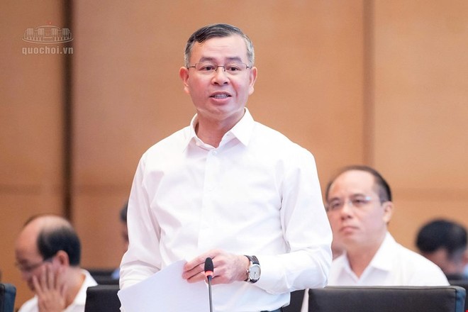 Bộ trưởng Bộ Tài chính Ngô Văn Tuấn hồi âm các vấn đề được đại biểu quan tâm - Ảnh: QH. 