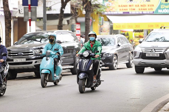 Sự phát triển nhanh của kinh tế nền tảng đặt ra yêu cầu hoàn thiện khung pháp lý đối với tài xế công nghệ. Ảnh: Đức Thanh