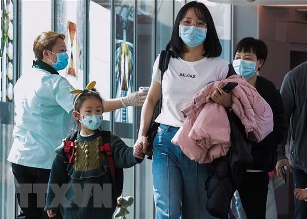 Hành khách tại sân bay quốc tế Changi, Singapore. Ảnh: TTXVN/AFP