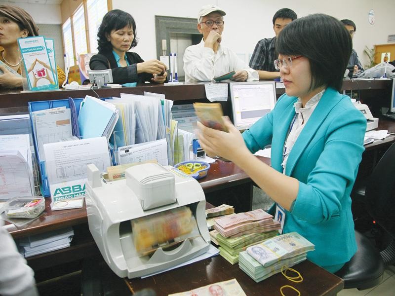 Tiền đồng tăng giá sẽ kích thích dòng vốn đầu tư vào Việt Nam, giảm gánh nặng thanh toán nợ nước ngoài... Ảnh: T.C