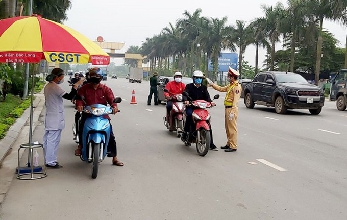 Các lực lượng phải thực hiện nghiêm, hiệu quả việc phòng chống dịch bệnh COVID-19, gắn với tuần tra kiểm soát, xử lý vi phậm trật tự an toàn giao thông vận tải. (Nguồn ảnh: Báo Bắc Ninh).