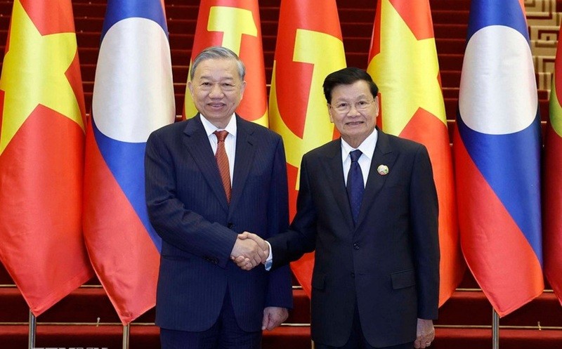 Tổng Bí thư Tô Lâm và Tổng Bí thư, Chủ tịch nước Lào Thongloun Sisoulith đồng chủ trì Cuộc gặp cấp cao giữa Đảng Cộng sản Việt Nam và Đảng Nhân dân Cách mạng Lào - Ảnh: Thống Nhất/TTXVN.