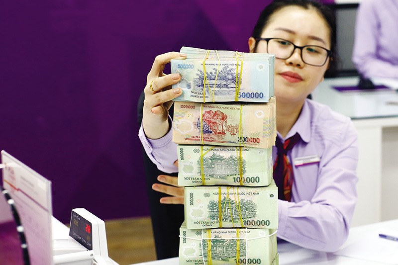 Giảm lãi suất và đơn giản điều kiện, thủ tục vay để vốn đến đúng, trúng và trực tiếp đến với doanh nghiệp. Ảnh: Đức Thanh