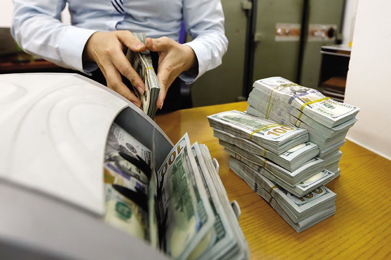 Sự can thiệp của Nhà nước khiến cổ đông nhỏ, người gửi tiền sẽ được bảo vệ khi ngân hàng thất bại. Ảnh: Đức Thanh 