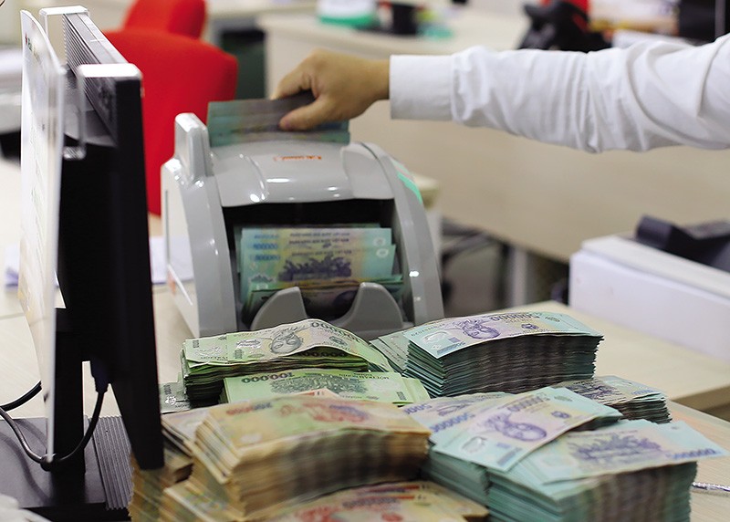 Việc sửa đổi đồng bộ hành lang pháp lý về xử lý nợ xấu sẽ kích thích thị trường nợ phát triển. Ảnh: Đức Thanh 