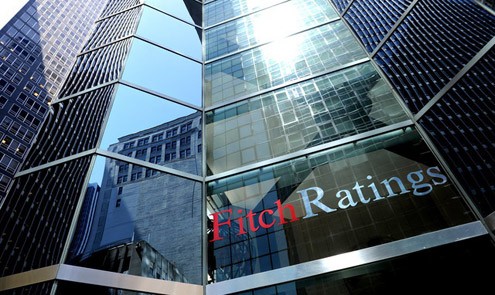 Fitch cho rằng kinh tế thế giới sẽ tiếp tục u ám trong năm 2012. Ảnh: Bloomberg